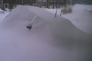 car buried in snow, rust, damage, not running